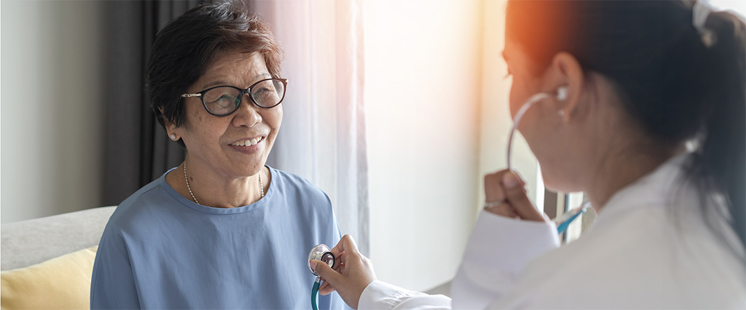 A doctor with a smiling patient.